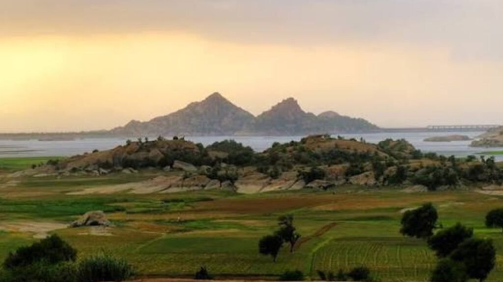 Scenic landscape of Jawai during the Rajasthan Monsoon Road Trip with lush greenery, granite hills and Jawai Dam.